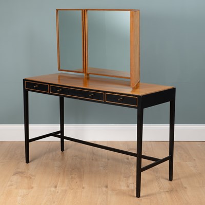 Lot 1044 - A Loughborough Furniture for Heal's black tan teak dressing table