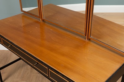 Lot 1044 - A Loughborough Furniture for Heal's black tan teak dressing table