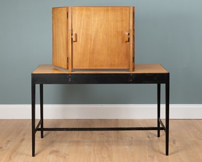 Lot 1044 - A Loughborough Furniture for Heal's black tan teak dressing table