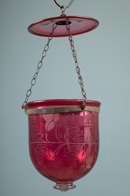 Lot 528 - A late 19th century cranberry glass storm lantern