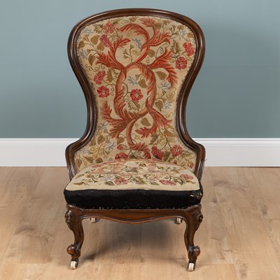 Lot 85 - A 19th century mahogany-framed ballon-back nursing chair