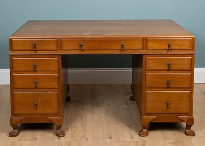 Lot 454 - A teak pedestal desk