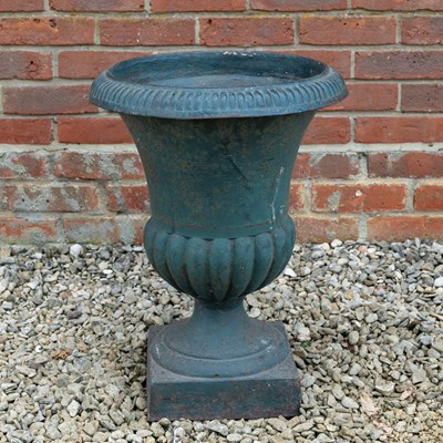 Lot 1479 - A green-painted cast iron tall Campagna style urn