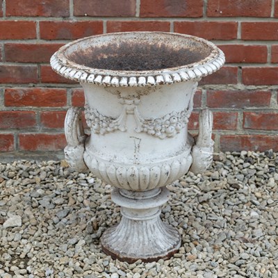 Lot 1342 - A white-painted cast iron garden urn