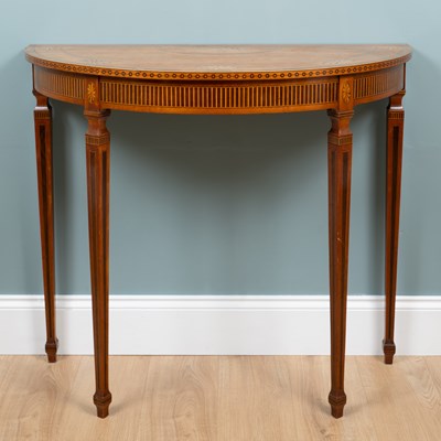 Lot 715 - An Edwardian satinwood and walnut inlaid demi-lune side table