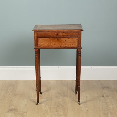 Lot 160 - A Regency oak and rosewood worktable