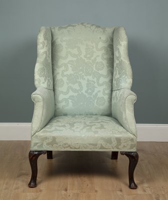 Lot 316 - A Georgian style wingback armchair