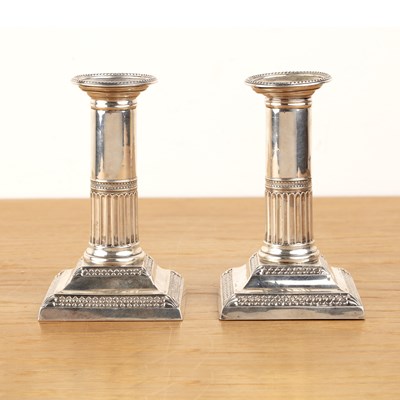 Lot 352 - Pair of silver candlesticks of squat...