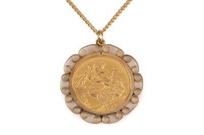 Lot 309 - A George V sovereign, dated 1911, in 9ct gold...