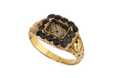 Lot 96 - A George IV memorial ring, the plaited...