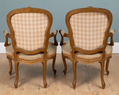 Lot 133 - A pair of Louis XV French gilt-framed elbow chairs