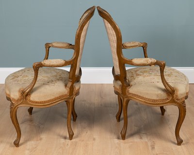 Lot 133 - A pair of Louis XV French gilt-framed elbow chairs