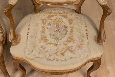 Lot 133 - A pair of Louis XV French gilt-framed elbow chairs