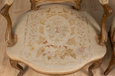 Lot 133 - A pair of Louis XV French gilt-framed elbow chairs