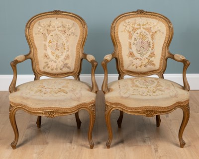 Lot 133 - A pair of Louis XV French gilt-framed elbow chairs