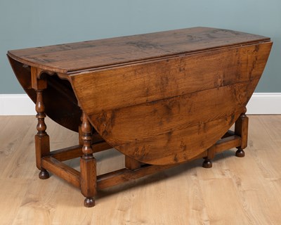 Lot 511 - An oak gateleg bespoke table