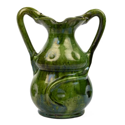 Lot 524 - A Farnham Pottery green-glazed vase