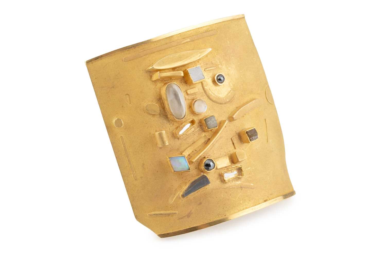 Lot 230 - A vari gem-set abstract panel brooch by...