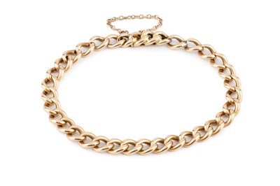 Lot 65 - A yellow precious metal curb-link bracelet,...