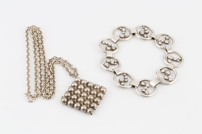 Lot 220 - A silver abstract pendant, in the form of a...