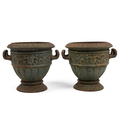 Lot 1340 - A pair of cast iron garden urns