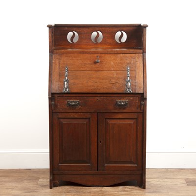 Lot 69 - Attributed to Liberty & Co oak, bureau, a...