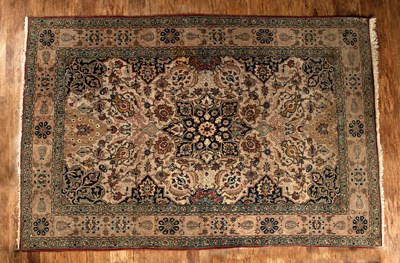 Lot 117 - Kashan rug of ivory ground with a central...