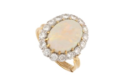 Lot 78 - An opal and diamond cluster ring, the central...