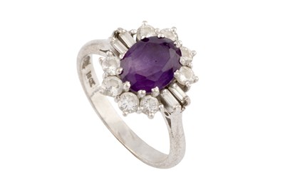 Lot 287 - An amethyst and diamond cluster ring, the oval...