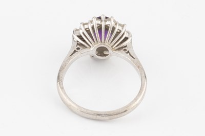Lot 287 - An amethyst and diamond cluster ring, the oval...