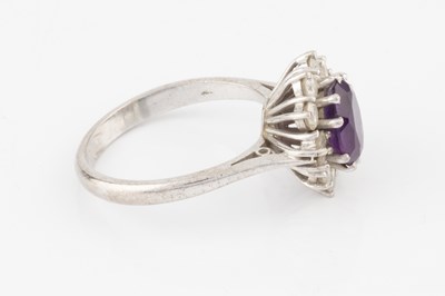 Lot 287 - An amethyst and diamond cluster ring, the oval...