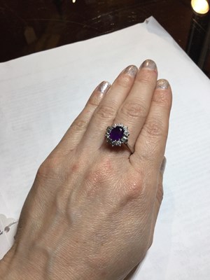 Lot 287 - An amethyst and diamond cluster ring, the oval...