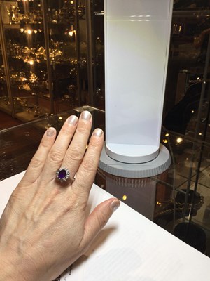 Lot 287 - An amethyst and diamond cluster ring, the oval...