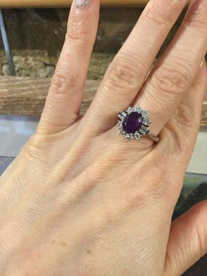 Lot 287 - An amethyst and diamond cluster ring, the oval...