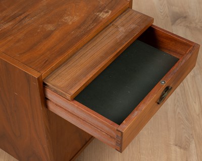 Lot 1168 - A small Art Deco style teak bedside cabinet
