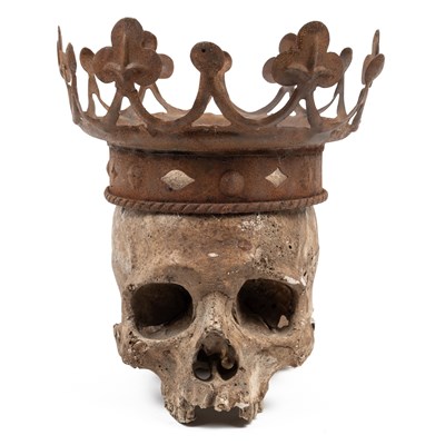 Lot 553 - A crowned plaster skull