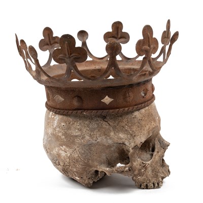 Lot 553 - A crowned plaster skull