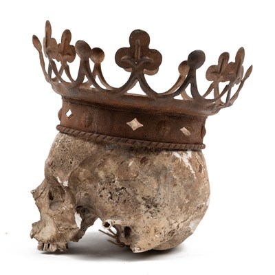 Lot 553 - A crowned plaster skull