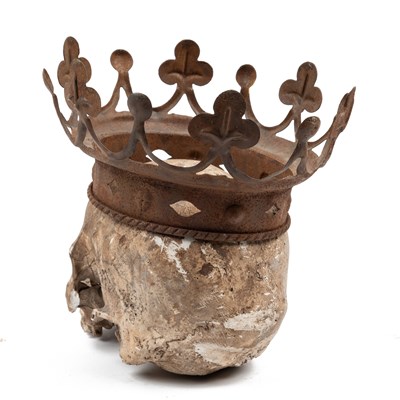 Lot 553 - A crowned plaster skull