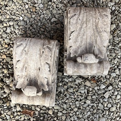 Lot 1354 - Two cast limestone scrolling corbels
