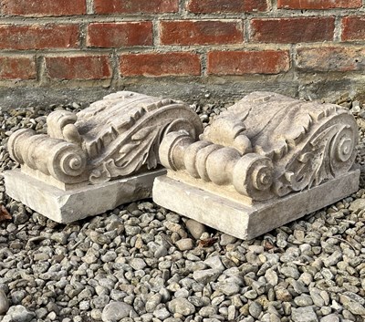 Lot 1354 - Two cast limestone scrolling corbels