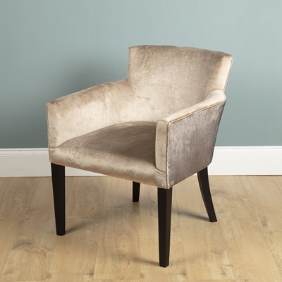 Lot 1018 - A cream Dralon upholstered armchair