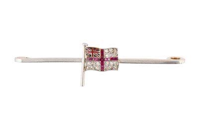 Lot 28 - A diamond, ruby and enamel flag brooch,...