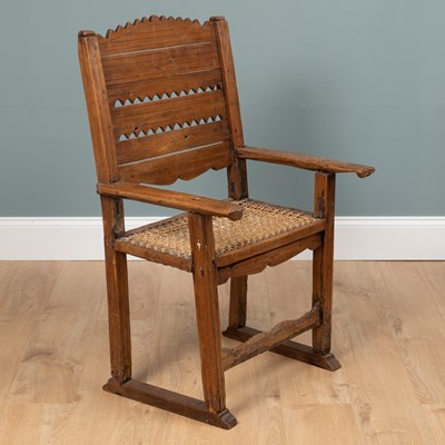Lot 1074 - A composed rustic armchair