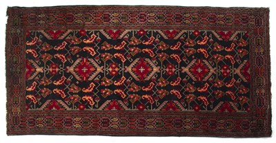 Lot 1297 - A Baluchi style hand-woven runner