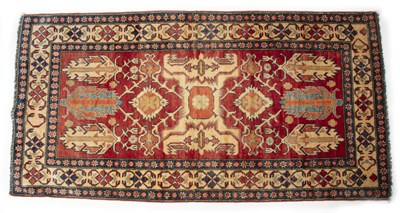 Lot 1320 - A Middle Eastern Kazak style rug