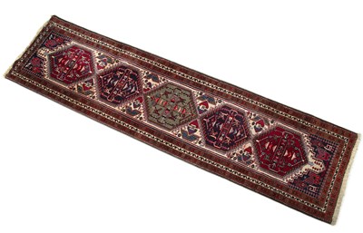 Lot 1239 - A Middle Eastern woollen runner