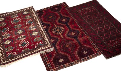 Lot 1308 - Three Middle Eastern red ground rugs