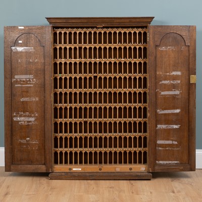 Lot 69 - An early 20th-century oak key cabinet