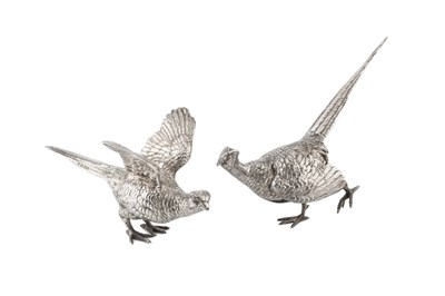 Lot A pair of silver pheasants, modelled as a...